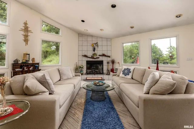 a living room with furniture and a piano