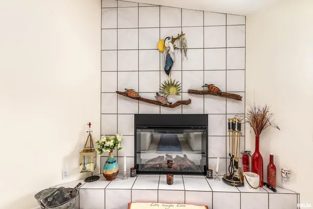 a view of wooden floor and a fireplace in a room