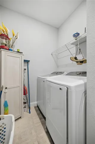 a bedroom with a bed and a table with wooden floor