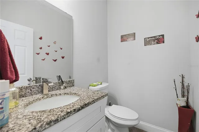 a kitchen with stainless steel appliances granite countertop a stove a refrigerator and a sink