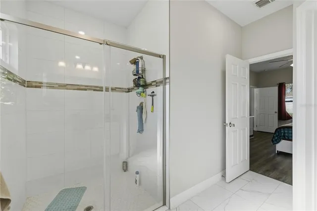 a view of a dining room with furniture wooden floor and a chandelier