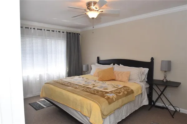 a bedroom with a bed and window