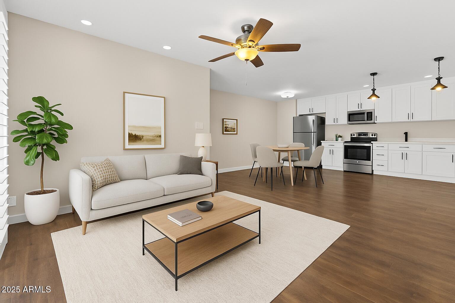 5525 East Thomas Road, Unit K16 Phoenix, AZ 85018 - Photo 13 of 36 a living room with furniture kitchen view and a potted plant