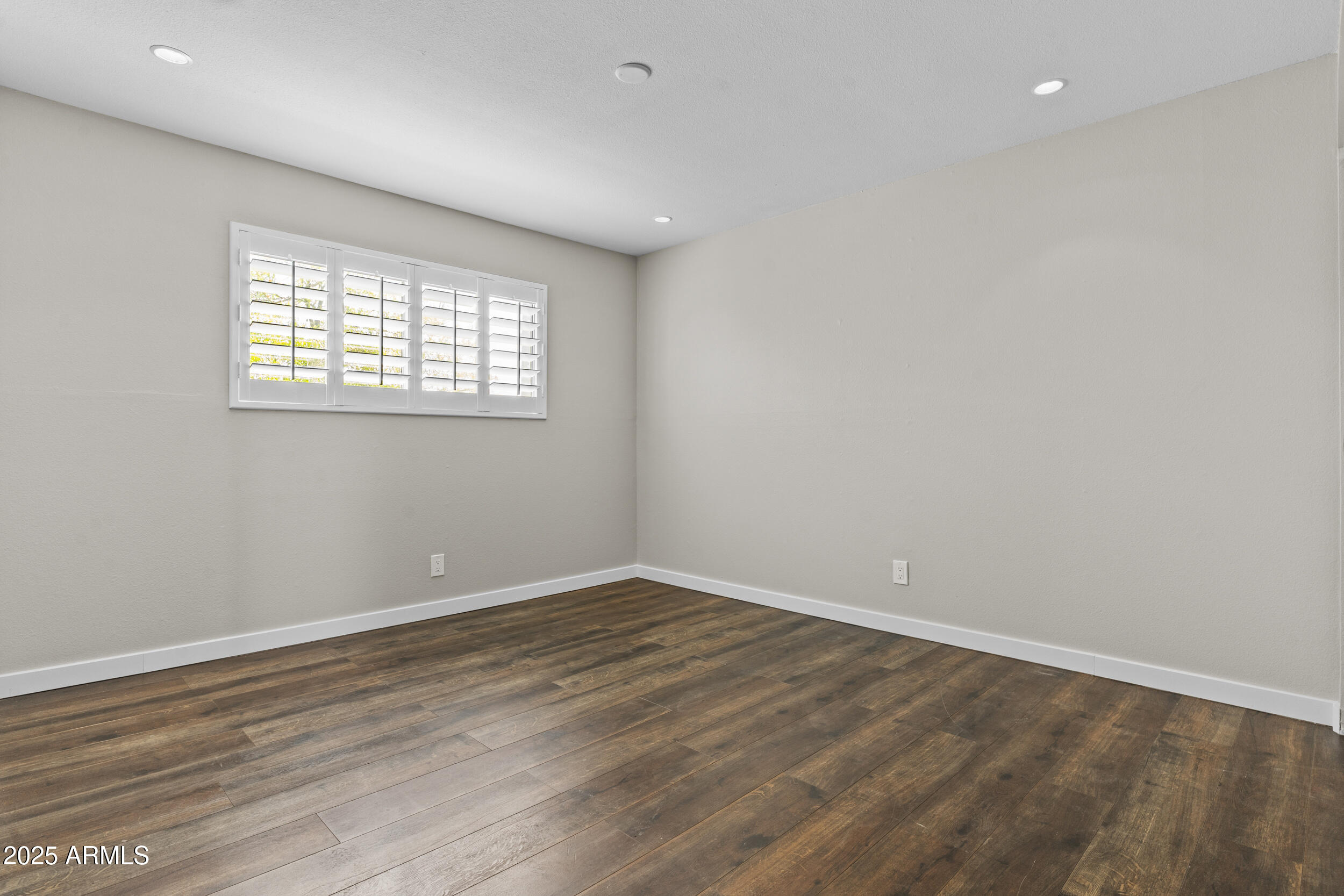 5525 East Thomas Road, Unit K16 Phoenix, AZ 85018 - Photo 21 of 36 wooden floor in an empty room with a window
