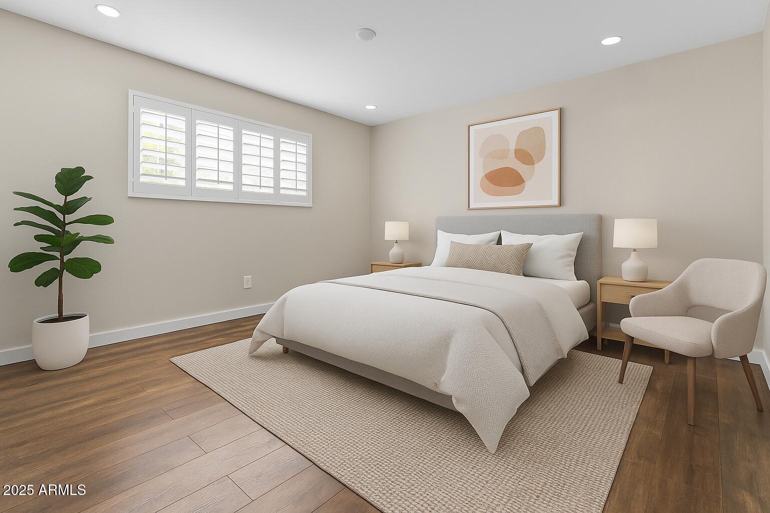 5525 East Thomas Road, Unit K16 Phoenix, AZ 85018 - Photo 22 of 36 a bedroom with a bed and a potted plant