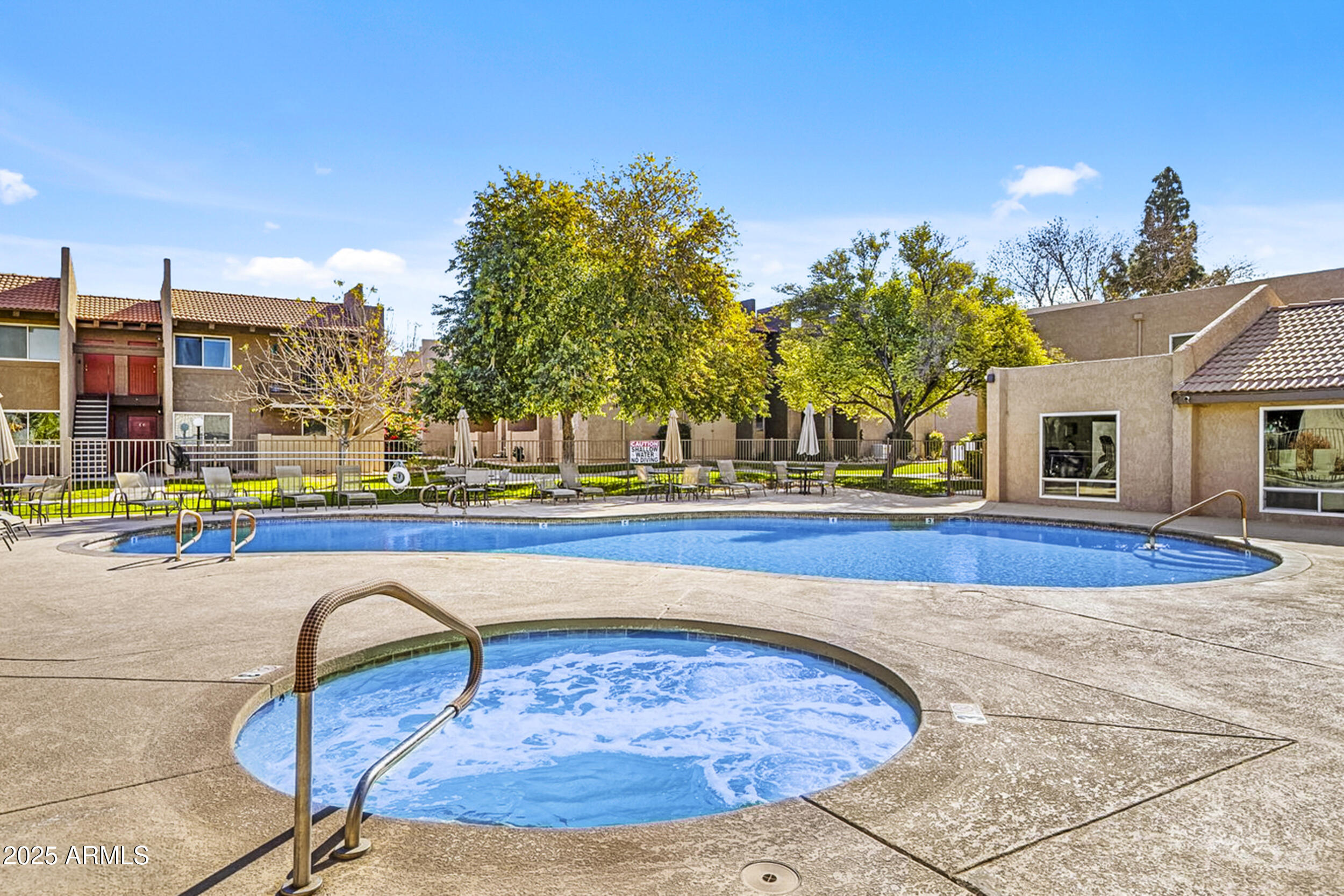 5525 East Thomas Road, Unit K16 Phoenix, AZ 85018 - Photo 4 of 36 a view of swimming pool with outdoor seating and yard in back