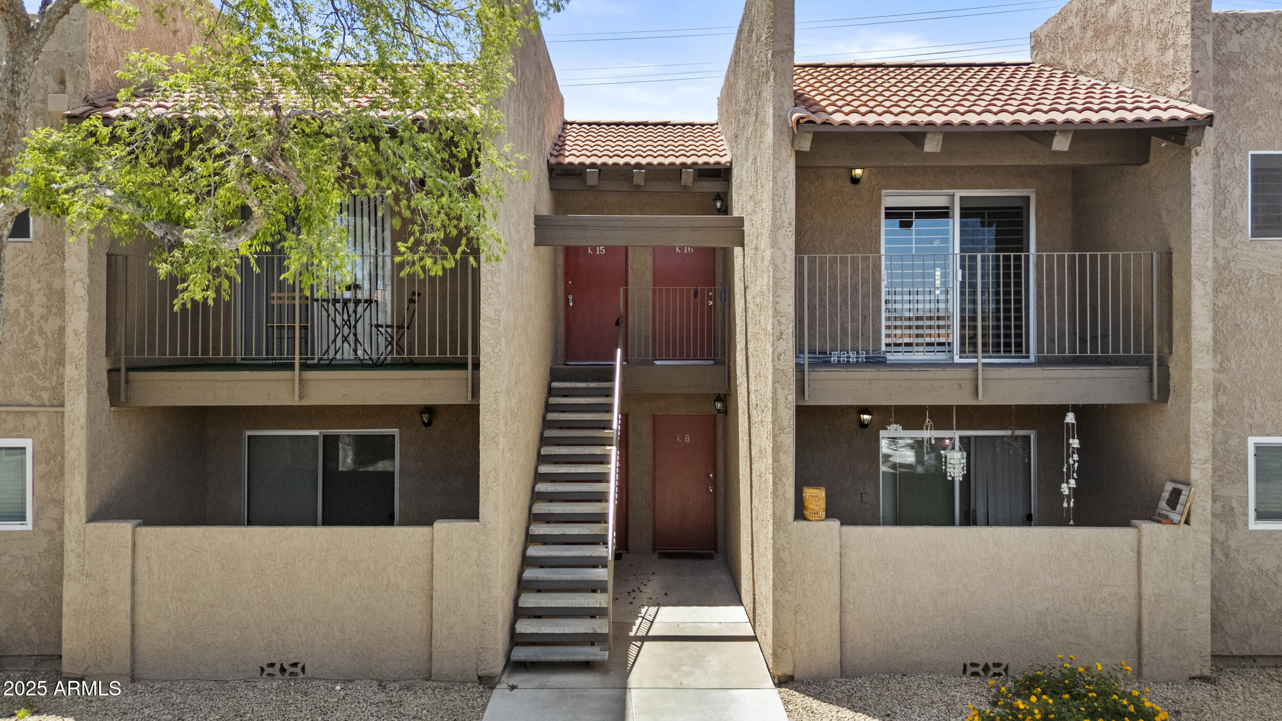 5525 East Thomas Road, Unit K16 Phoenix, AZ 85018 - Photo 5 of 36 a front view of a house with a garage