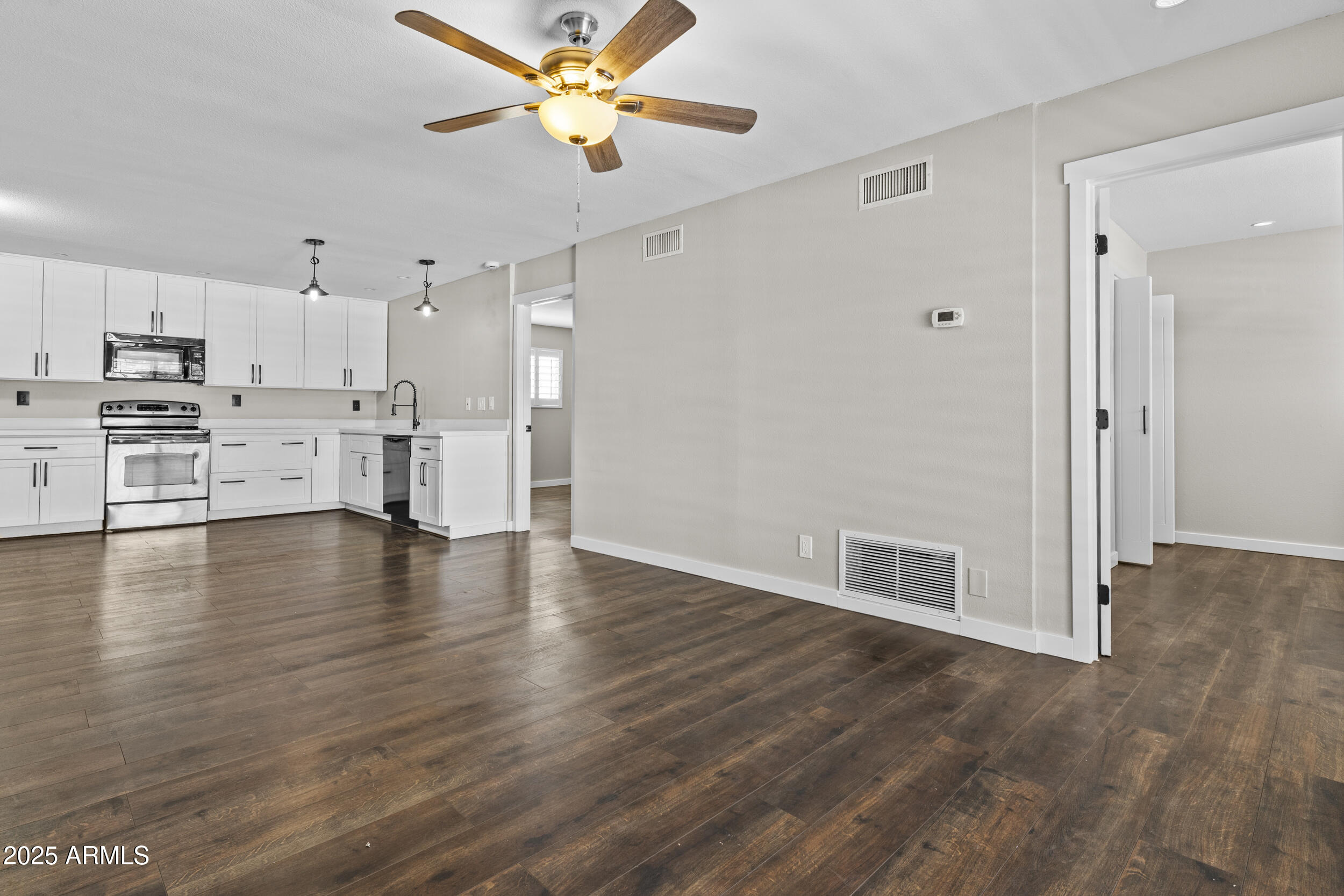 5525 East Thomas Road, Unit K16 Phoenix, AZ 85018 - Photo 7 of 36 a view of a kitchen with a sink and a stove top oven