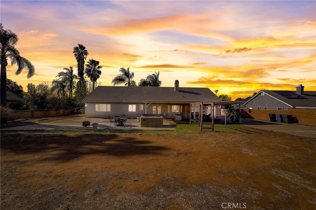 4920 Meadowland Drive Riverside, CA 92509 - Photo 26 of 28 a view of a big house with a big yard and large trees