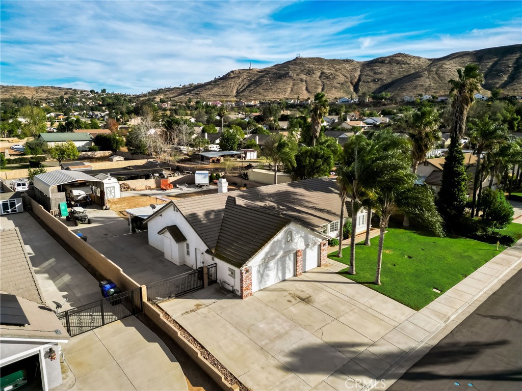 4920 Meadowland Drive Riverside, CA 92509 - Photo 4 of 28 a view of a terrace with a garden and mountain view