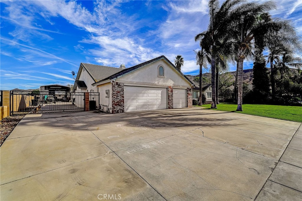4920 Meadowland Drive Riverside, CA 92509 - Photo 6 of 28 a house with trees in front of it