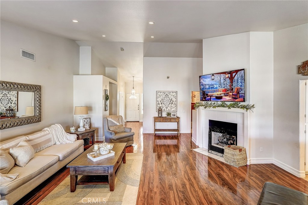 4920 Meadowland Drive Riverside, CA 92509 - Photo 8 of 28 a living room with furniture and a fireplace