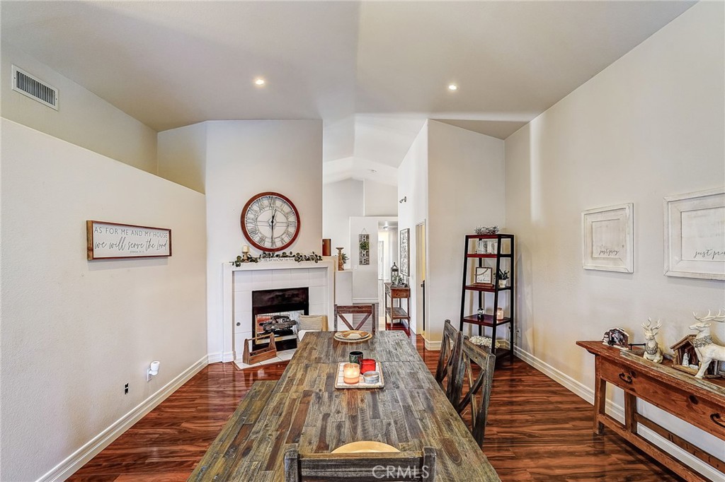 4920 Meadowland Drive Riverside, CA 92509 - Photo 10 of 28 a living room with furniture a rug and a fireplace