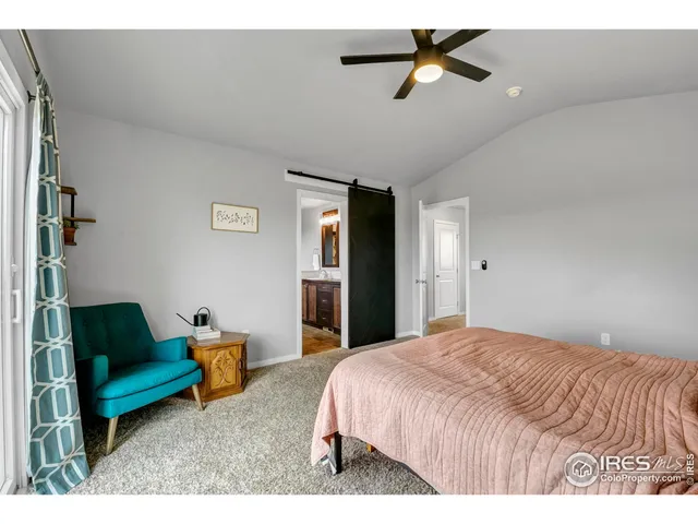 a bedroom with furniture and a chandelier