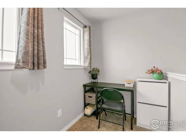 a dining room that has a table and a chair in it
