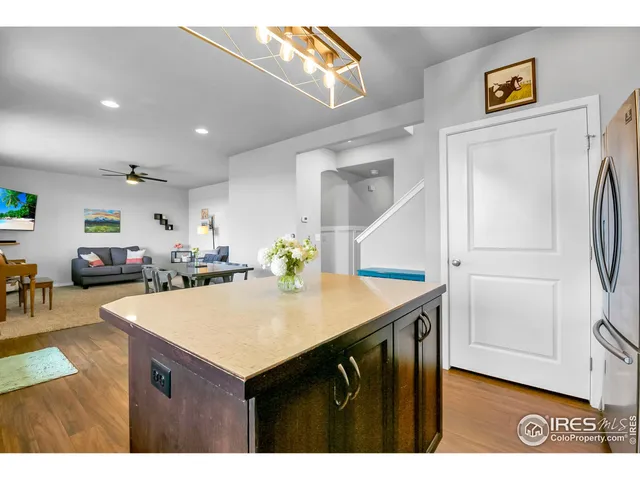 a kitchen with a sink a refrigerator and a stove
