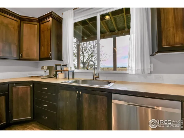 a kitchen with a sink and a window