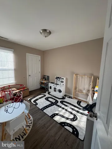 a living room with furniture and next to a window
