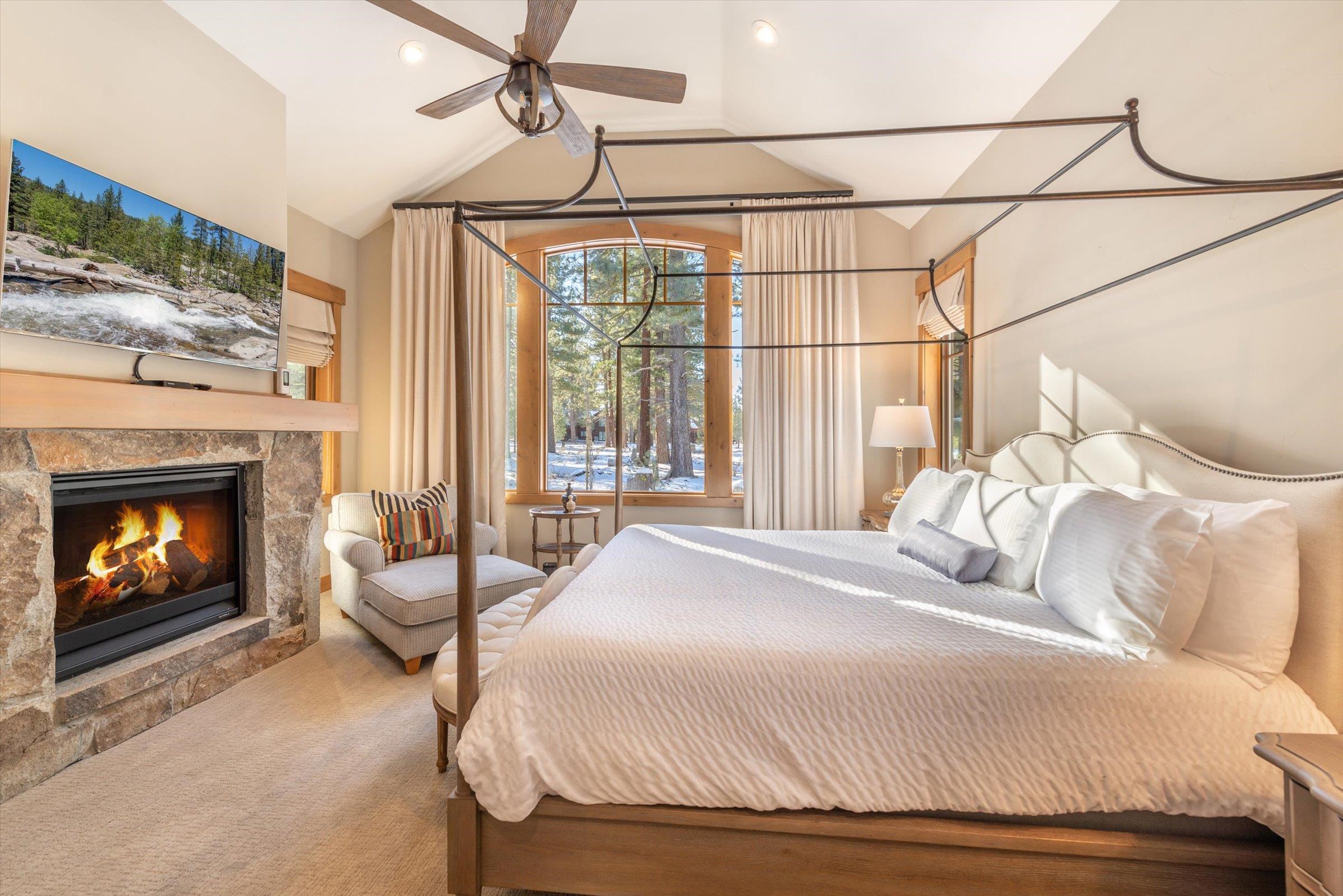 12427 Caleb Drive Truckee, CA 96161 - Photo 11 of 21 a bedroom with a bed and a fireplace