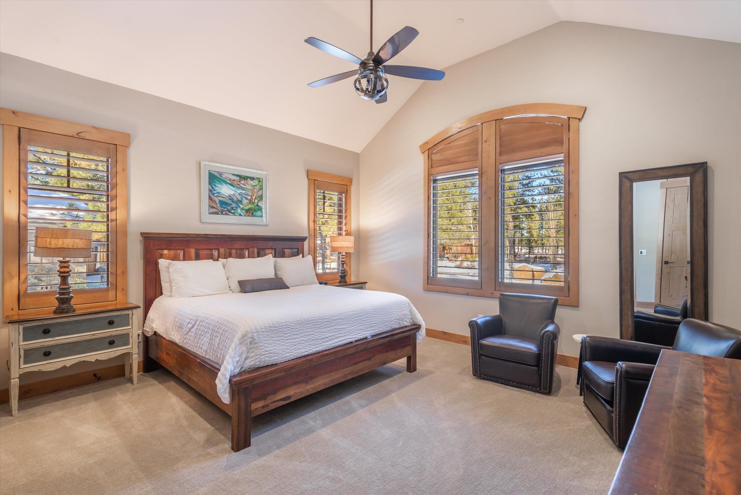 12427 Caleb Drive Truckee, CA 96161 - Photo 13 of 21 a bedroom with a bed a couch and a potted plant