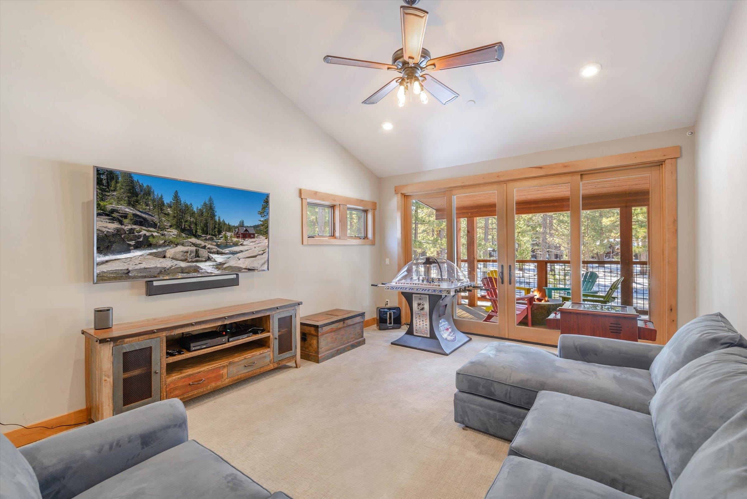 12427 Caleb Drive Truckee, CA 96161 - Photo 15 of 21 a living room with furniture a flat screen tv and a large window