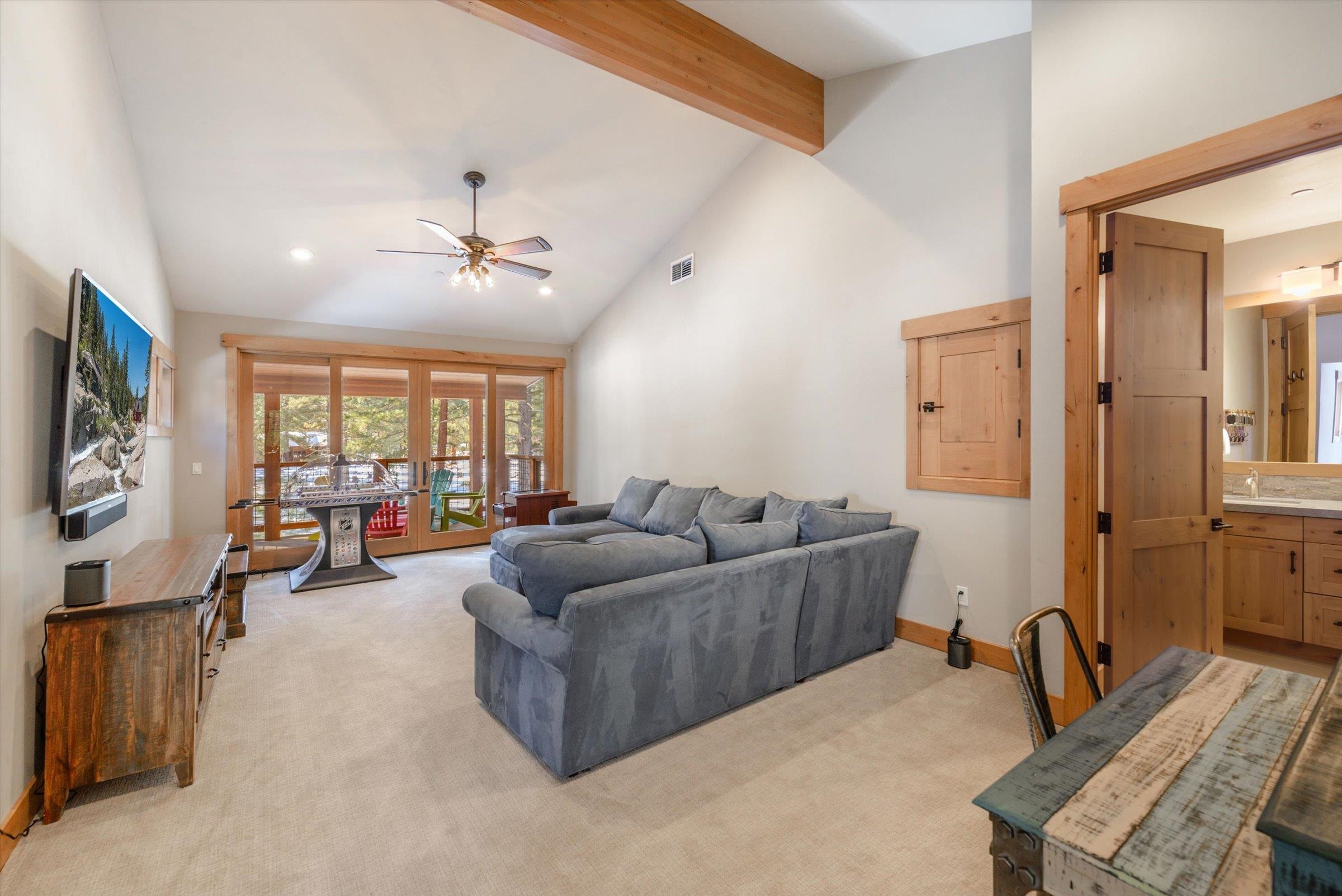 12427 Caleb Drive Truckee, CA 96161 - Photo 17 of 21 a living room with furniture and a flat screen tv