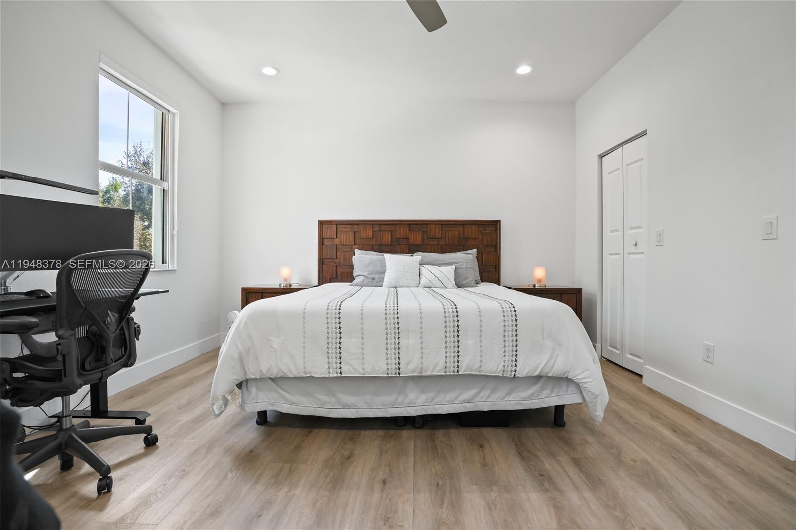 2913 Cascada Isle Way Cooper City, FL 33024 - Photo 16 of 50 a bedroom with a bed and wooden floor