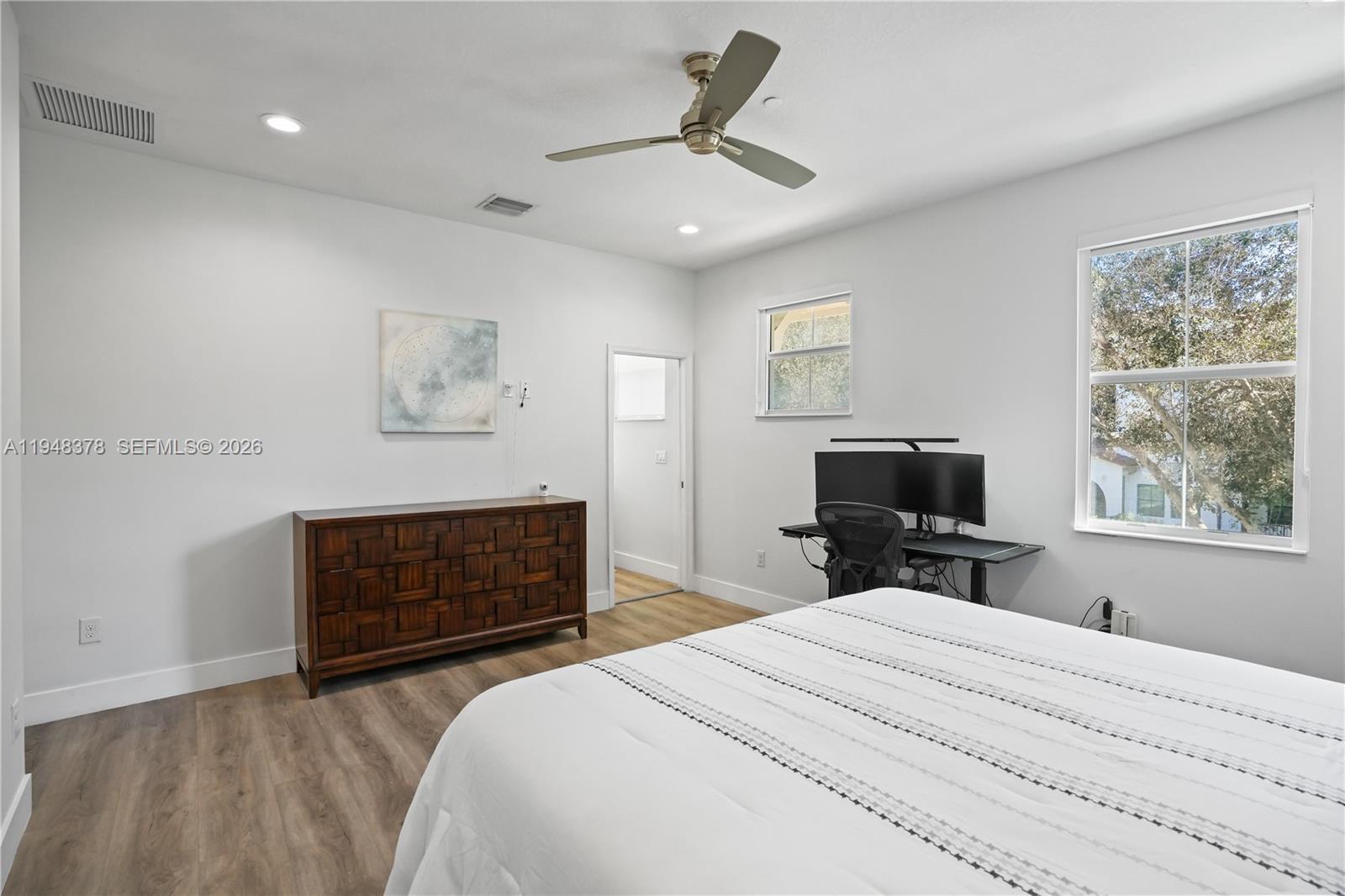 2913 Cascada Isle Way Cooper City, FL 33024 - Photo 18 of 50 a bedroom with a bed dresser and a window