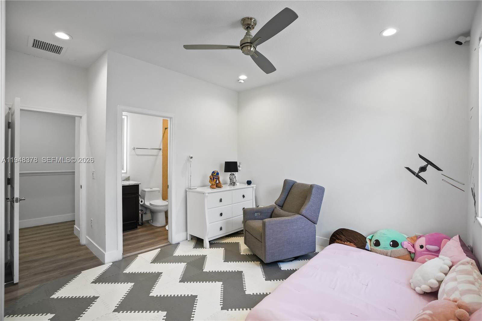 2913 Cascada Isle Way Cooper City, FL 33024 - Photo 23 of 50 a bedroom with furniture and a rug