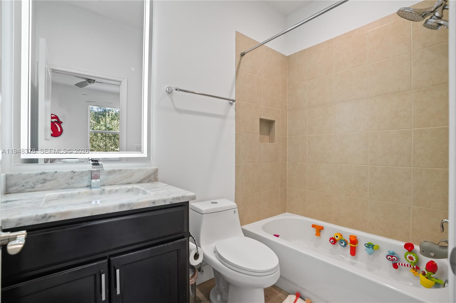 2913 Cascada Isle Way Cooper City, FL 33024 - Photo 25 of 50 a bathroom with a sink vanity mirror and toilet