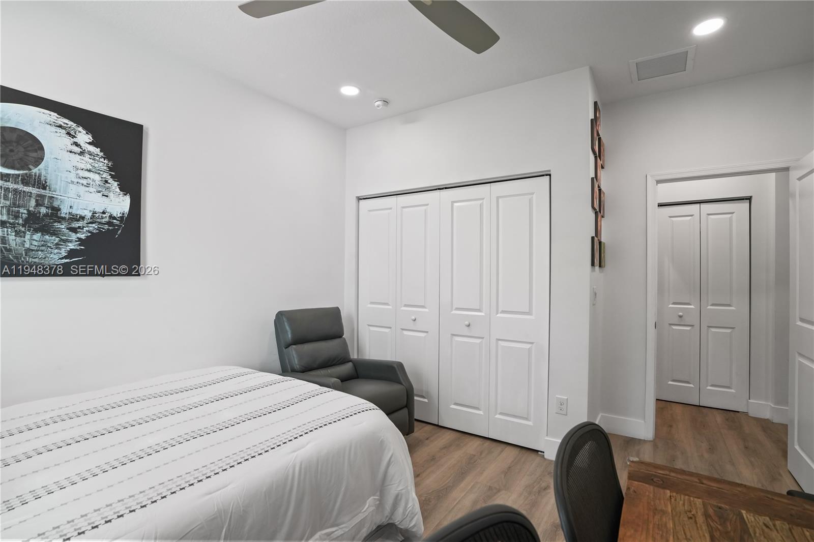 2913 Cascada Isle Way Cooper City, FL 33024 - Photo 29 of 50 a bedroom with a bed and a chair