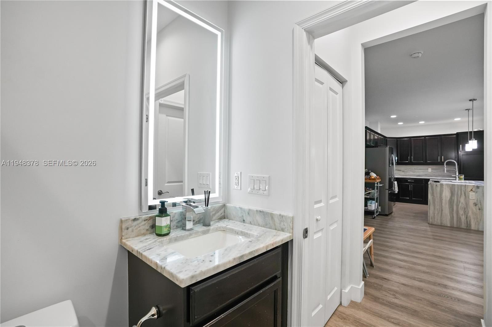 2913 Cascada Isle Way Cooper City, FL 33024 - Photo 31 of 50 a view of a kitchen from the hallway