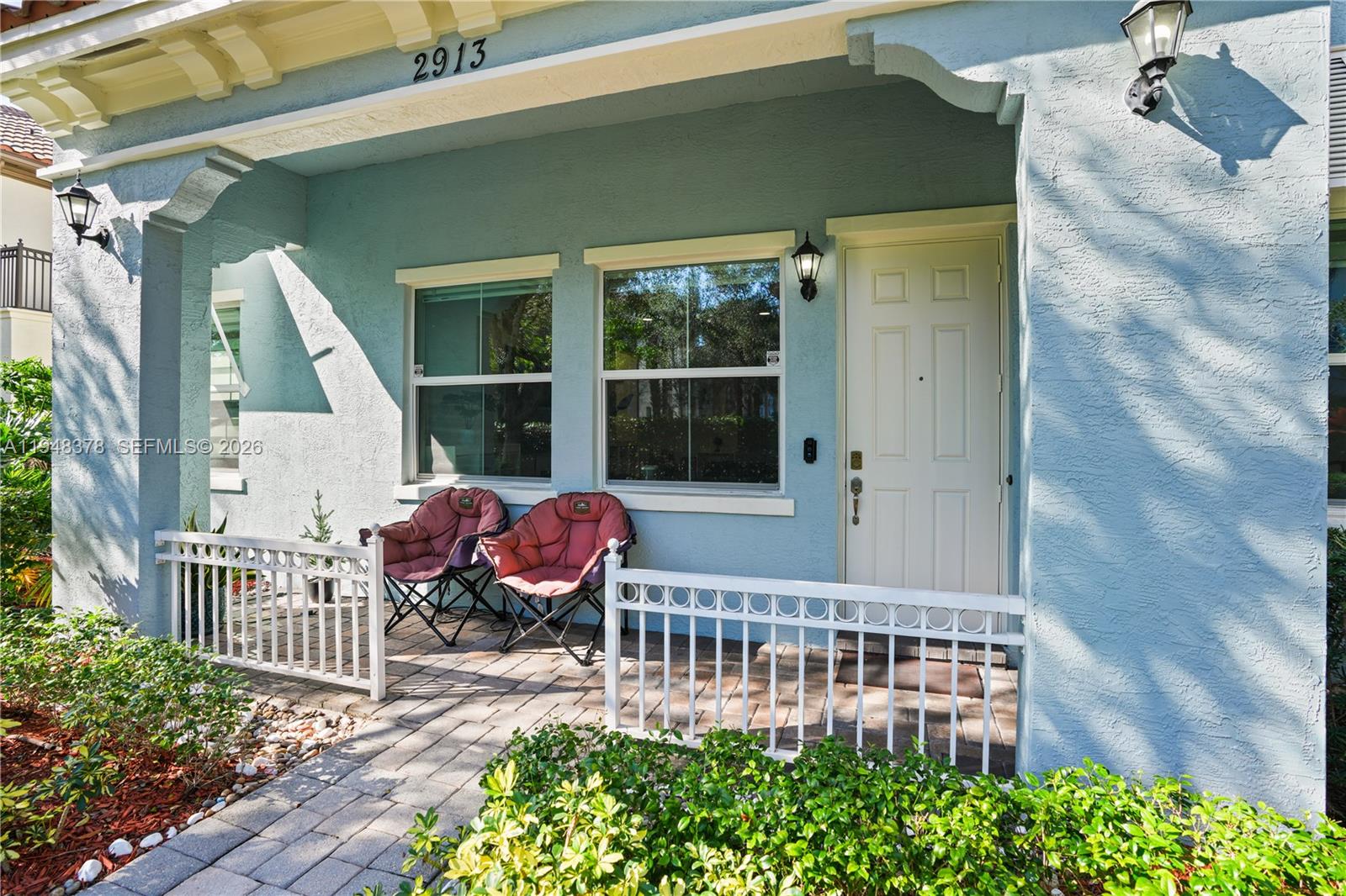 2913 Cascada Isle Way Cooper City, FL 33024 - Photo 33 of 50 a view of a house with a small yard and wooden floor and fence
