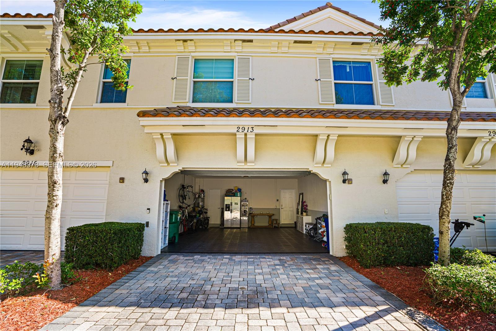 2913 Cascada Isle Way Cooper City, FL 33024 - Photo 36 of 50 a view of a white house with a outdoor space