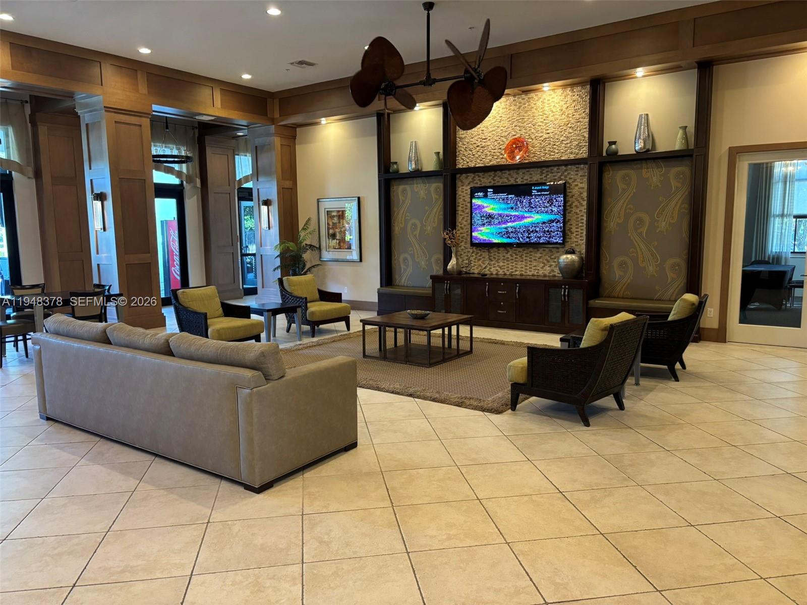 2913 Cascada Isle Way Cooper City, FL 33024 - Photo 40 of 50 a living room with couch and a flat screen tv