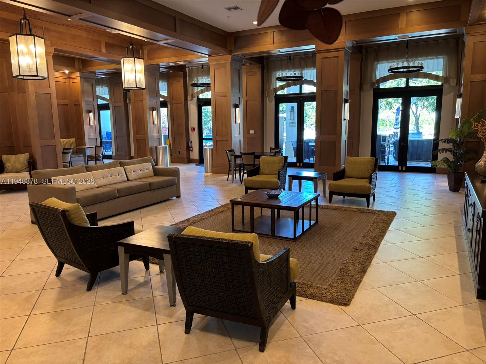 2913 Cascada Isle Way Cooper City, FL 33024 - Photo 41 of 50 a living room with couches and a dining table with kitchen view
