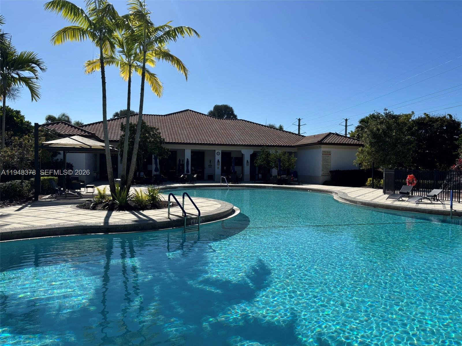 2913 Cascada Isle Way Cooper City, FL 33024 - Photo 47 of 50 a view of a house with swimming pool and a yard