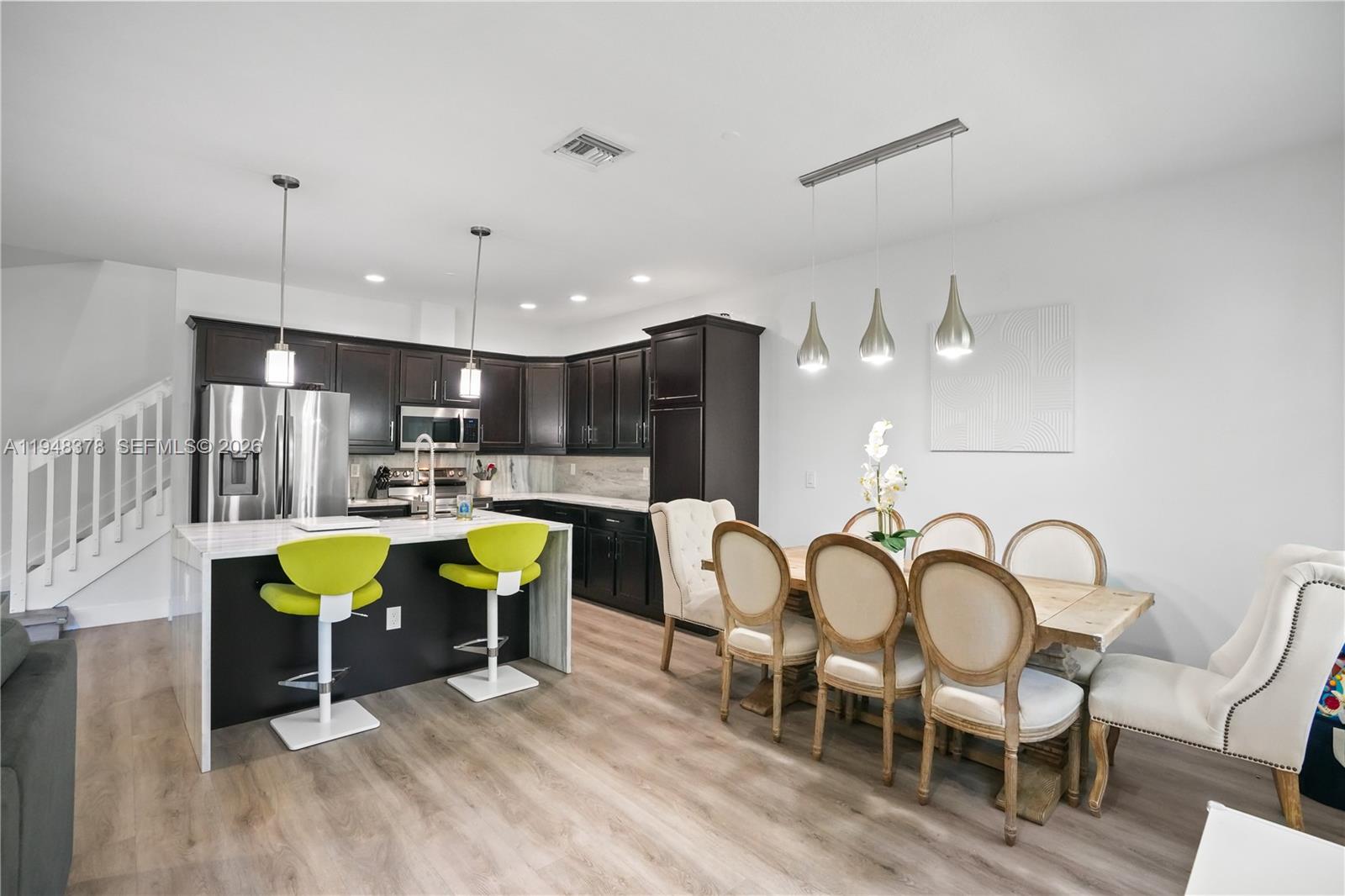 2913 Cascada Isle Way Cooper City, FL 33024 - Photo 7 of 50 a living room with furniture and kitchen view