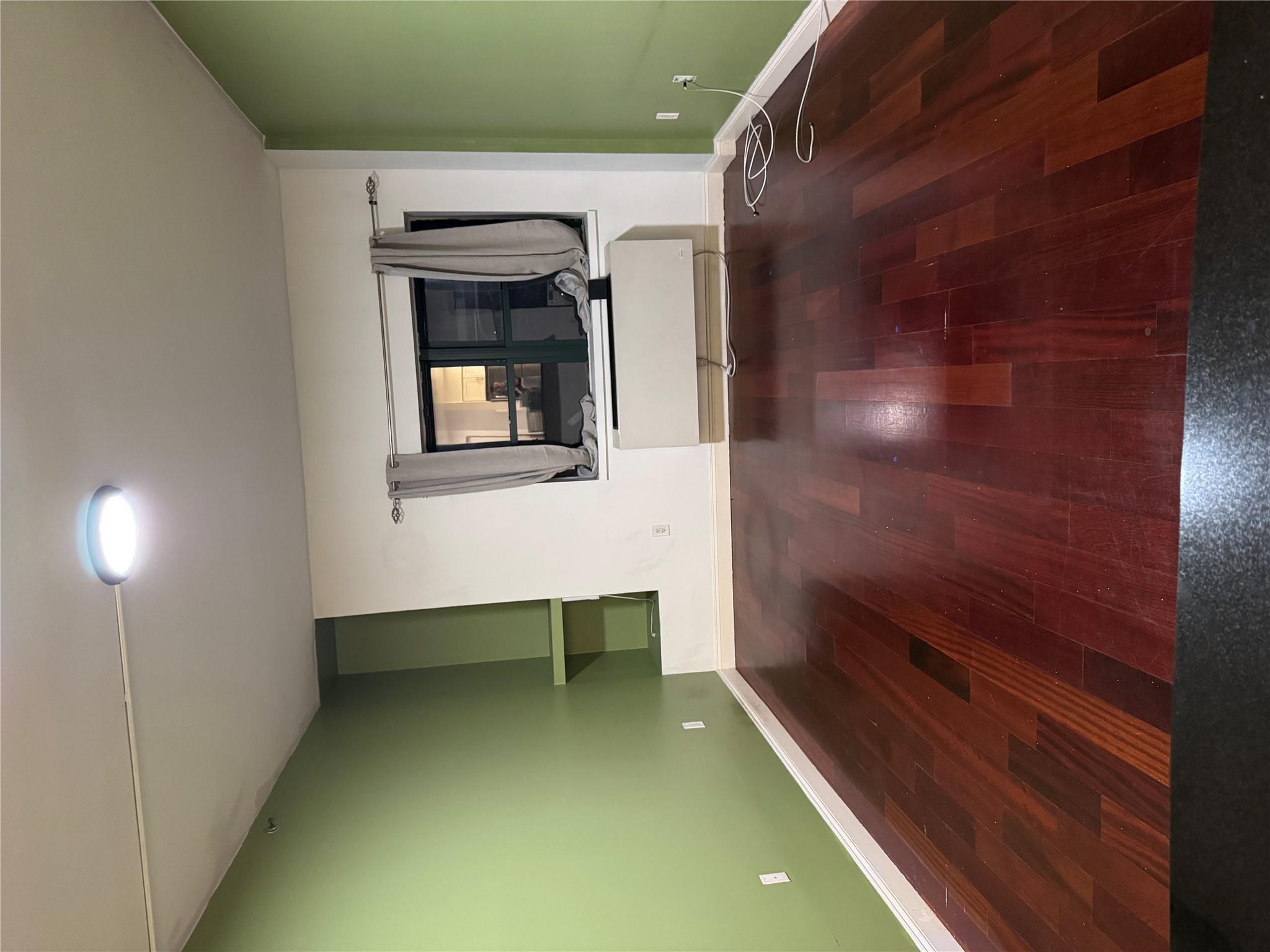 143-41 84th Drive, Unit 1A Queens, NY 11435 - Photo 3 of 7 a view of a livingroom with wooden floor and a ceiling fan