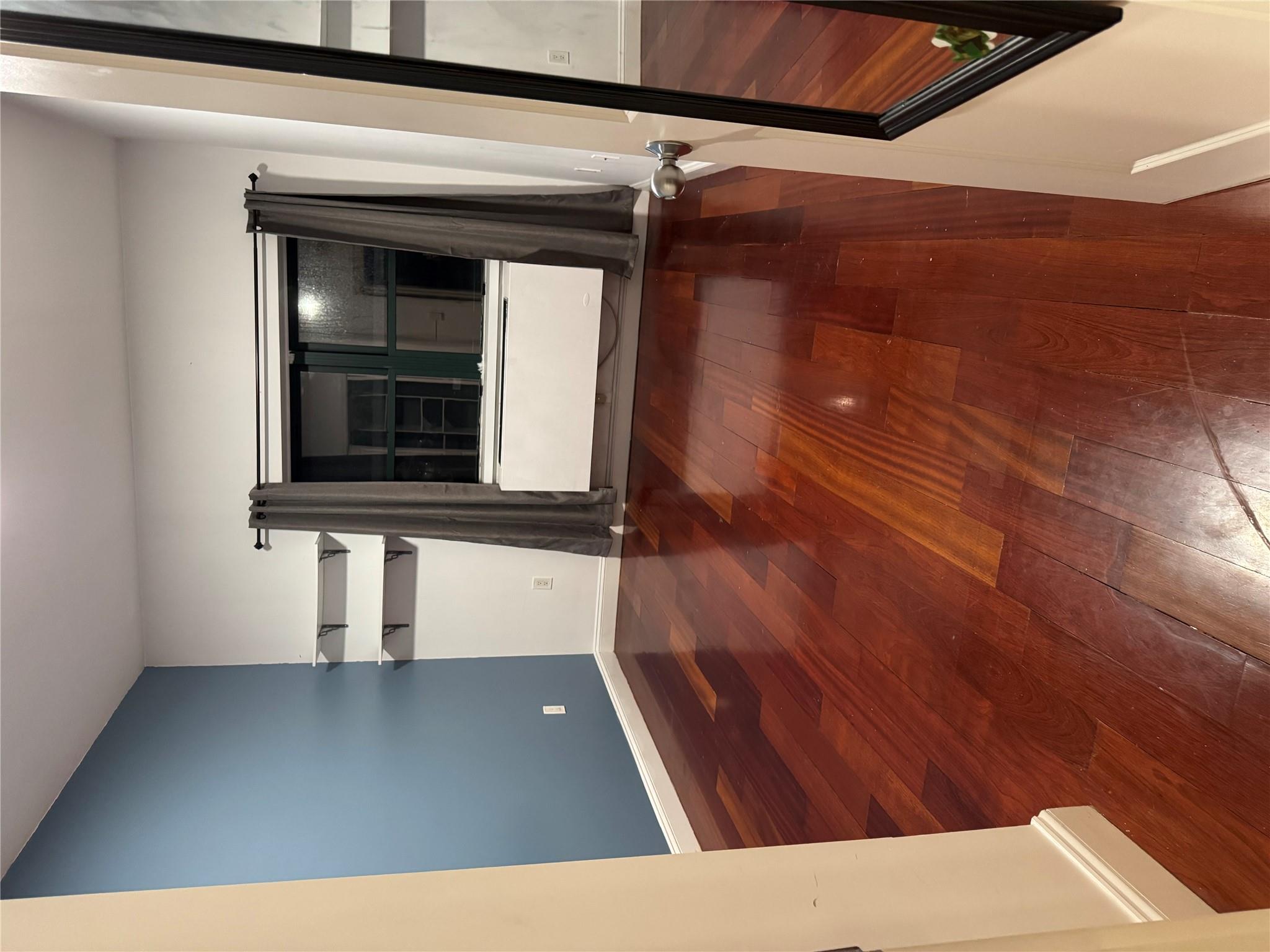 143-41 84th Drive, Unit 1A Queens, NY 11435 - Photo 4 of 7 a view of entryway with wooden floor