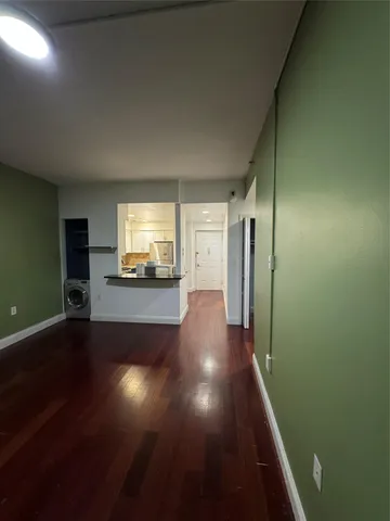 a view of gallery with wooden floor