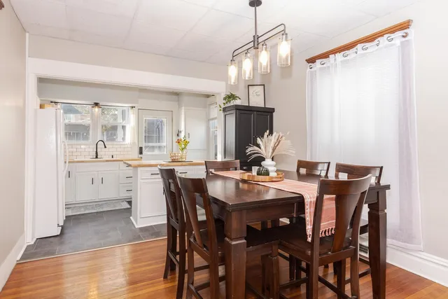 a view of a kitchen with granite countertop a sink and a window