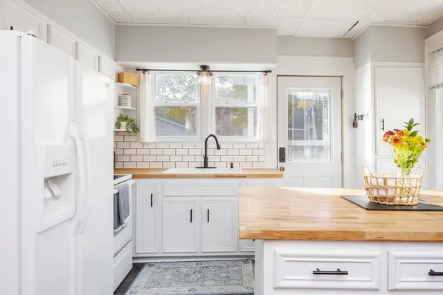 a bathroom with a sink vanity and a mirror