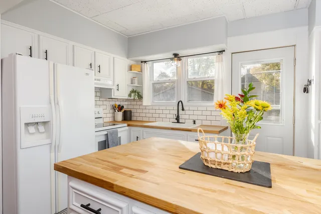 a bathroom with a sink a vanity and a mirror