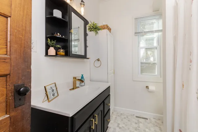 a bedroom with a large bed and a dresser