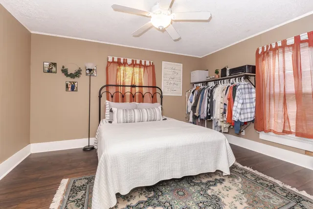 a bedroom with a bed and furniture