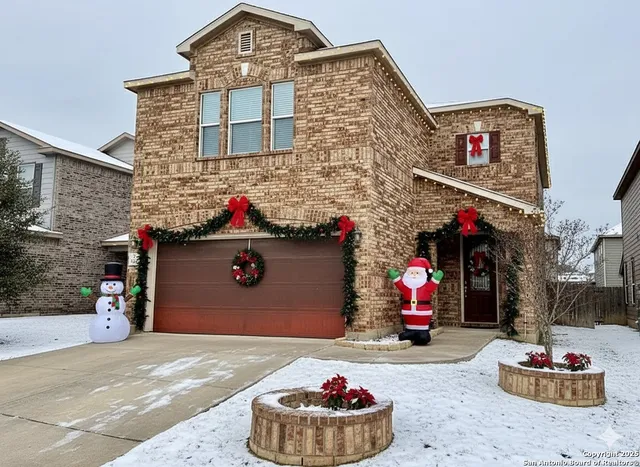 a front view of a house with a garage
