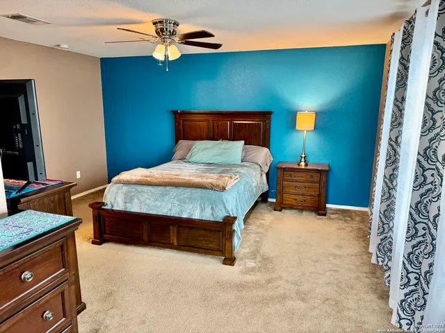 a bedroom with bed and window