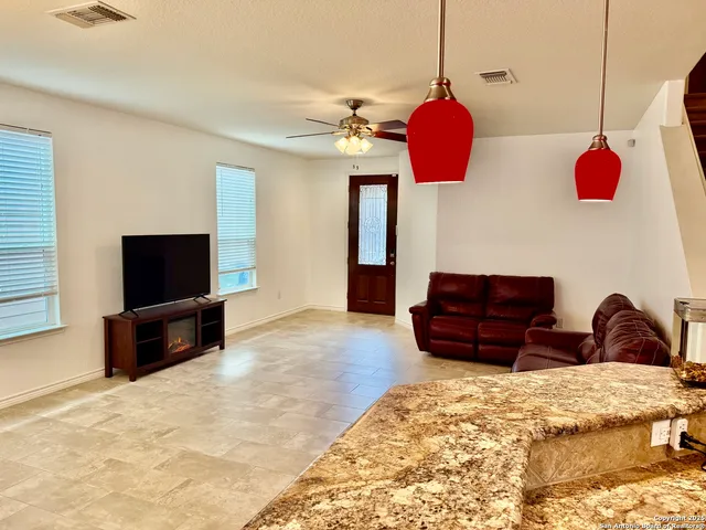 a living room with a couch and a flat screen tv