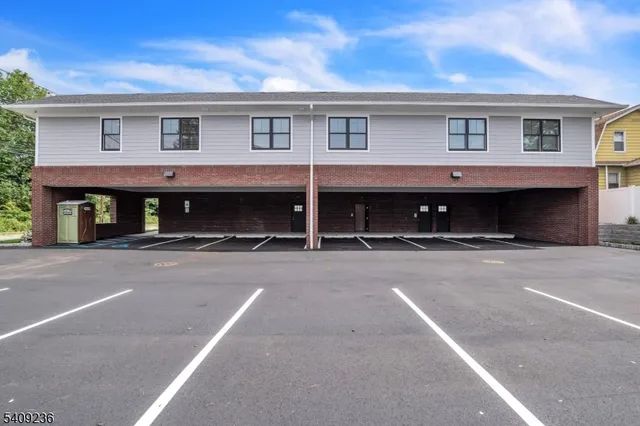 a front view of a house with a garage